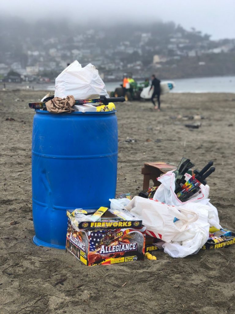 trash barrel filled with fireworks debris