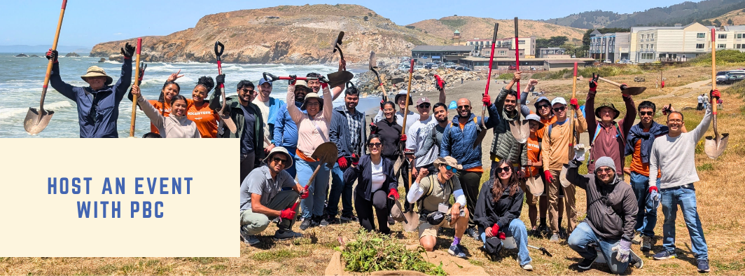 Adult volunteers pose with shovels in front of the ocean at a corporate habitat restoration event with PBC
