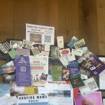 Soul Grind, a coffee shop in Pacifica, has a packed bulletin board. EcoFest Flyer is at the top.