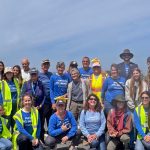 A group of Pacific Beach Coalition members stand together at EcoFest 2026
